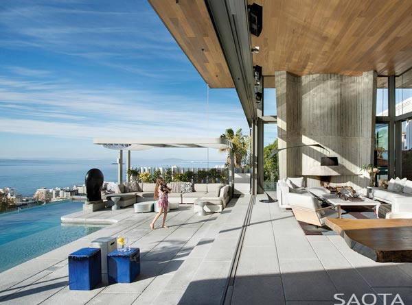 A terrace with infinity pool overlooking the seaside.
