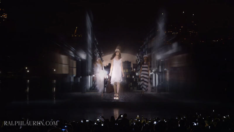 Models present the new collection as holograms.