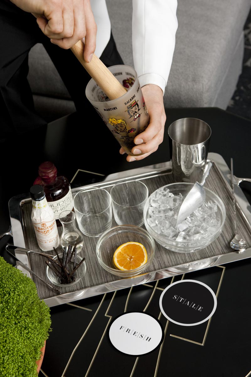 A bartender is doing his job.