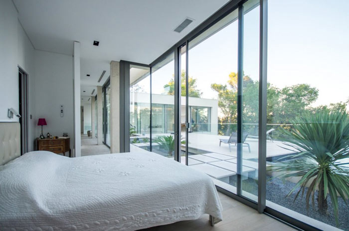 The bedroom facing the patio and the beautiful landscape.