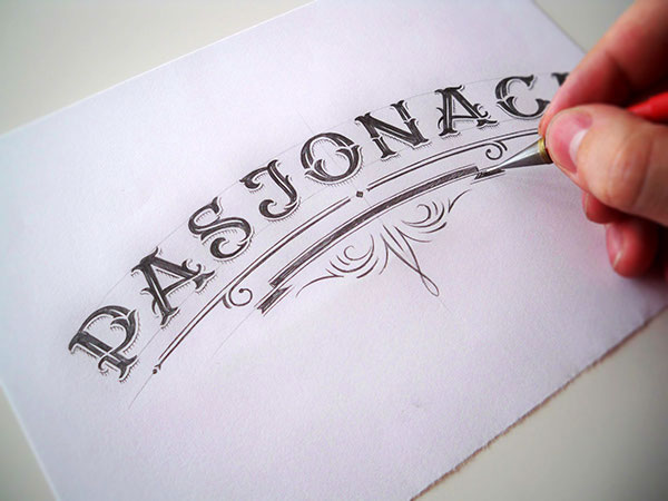 Hand lettering process of a unique logotype. Every detail was drawn with a pencil before vectorization.