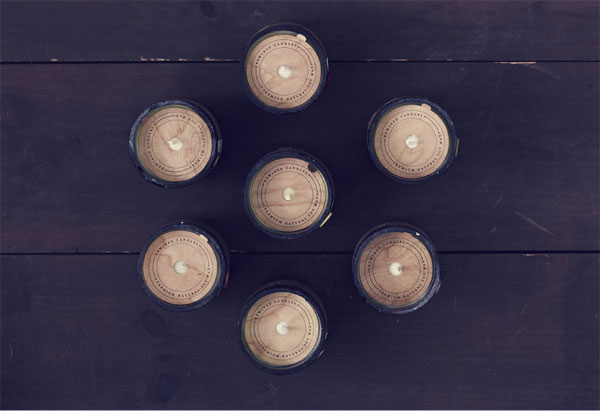 Candles poured into discarded wine bottles - Top view.