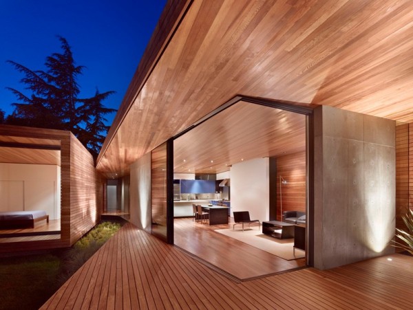 The architectural design is characterized by wood and simple forms.