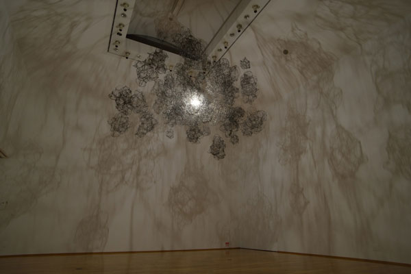 The illuminated construction creates surreal shadows.