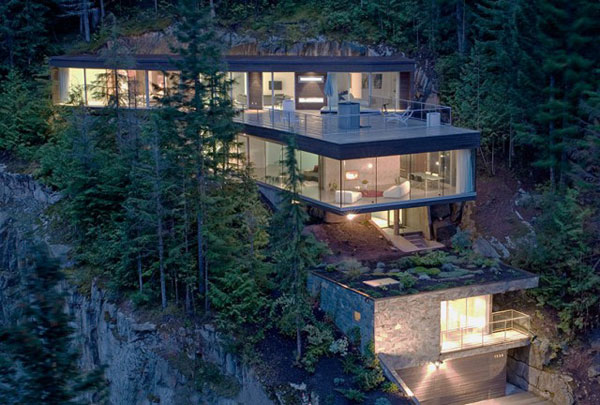 The Khyber Ridge house by Studio (n-1) Architects is distributed along a steep slope. The Khyber Ridge house by Studio (n-1) Architects is distributed along a steep slope.