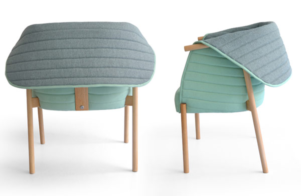 The chair's back cocoons can be folded up and down.