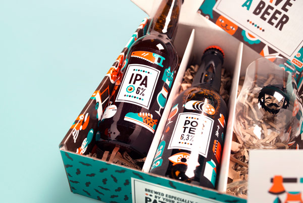 Close up of the open package with included beer bottles and a glass.