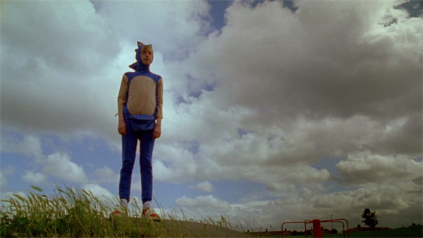 The story follows a lonely boy in a deserted suburban landscape, who is dressed like his favorite video game hero.