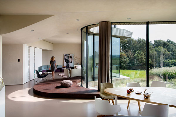 An arched glass front is the striking feature in the living area.