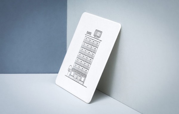 A card with a simle line illustration of the hotel plus cube on the rooftop.