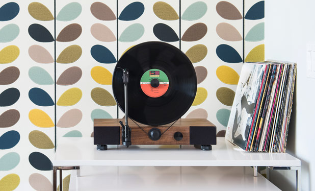 This high-performance vertical turntable with full-range stereo speakers is also a stylish design element for your home. This high-performance vertical turntable with full-range stereo speakers is also a stylish design element for your home.