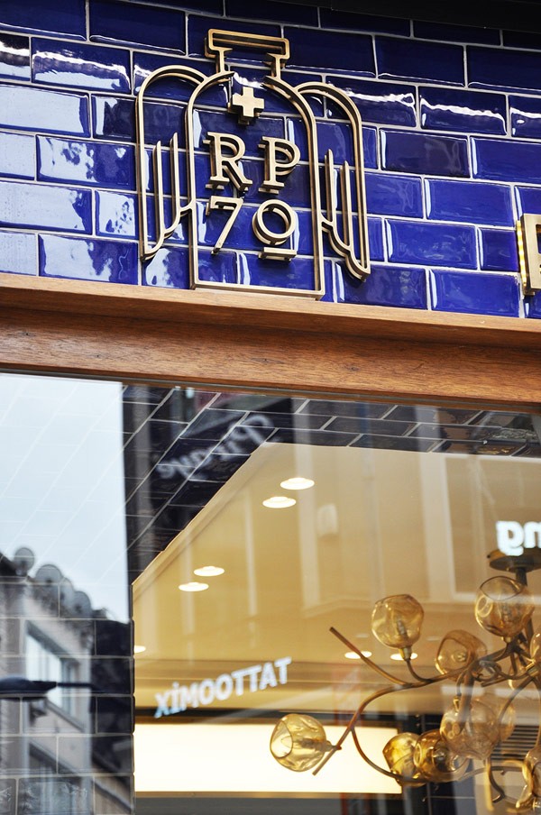 The logo signage mounted above the store window.