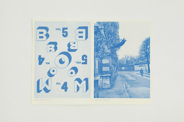 A blue printed double-page spread.