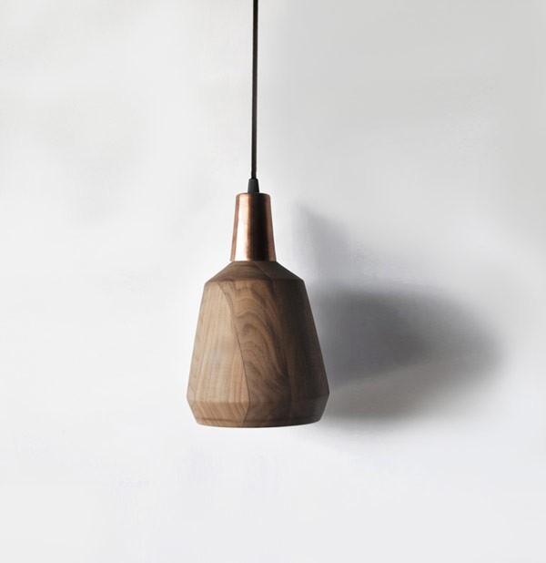 Nutshell is a hand made suspension lamp of copper and walnut.