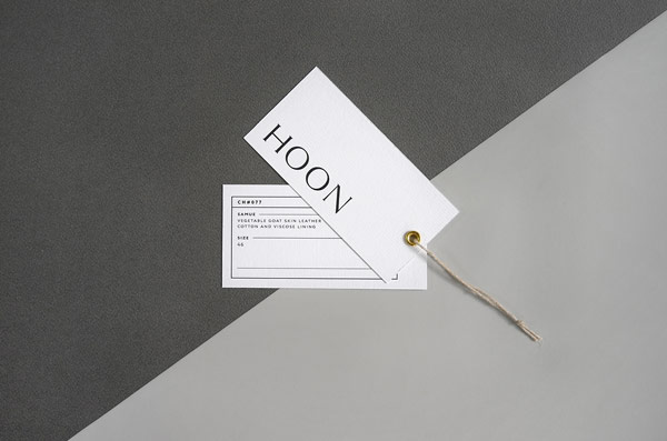 Two hang tags designed by French Say What Studio for the HOON leather shop.