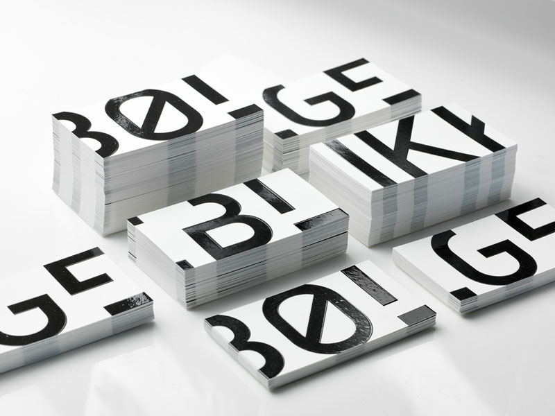 A typographic design based on bold, black letters on white background.