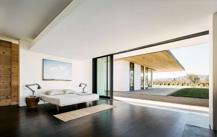 Large fully glazed sliding doors can be pushed aside to create a seamless transition between interior and exterior space.