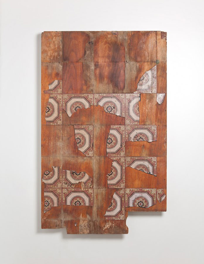 This mixed media artwork is utilizing old tiles.