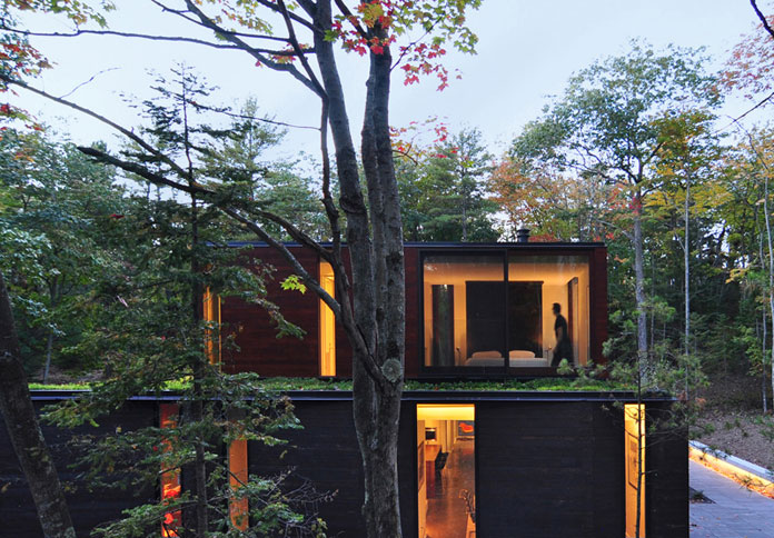 The exterior of this beautiful home is made of a variety of materials such as charred cedar siding as well as varnished clear cedar, dark-anodized aluminum, and glass. The exterior of this beautiful home is made of a variety of materials such as charred cedar siding as well as varnished clear cedar, dark-anodized aluminum, and glass.