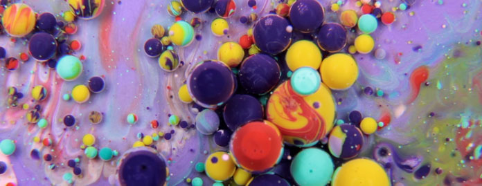 The short video provides a dreamlike and colorful take on circular moves and liquids.