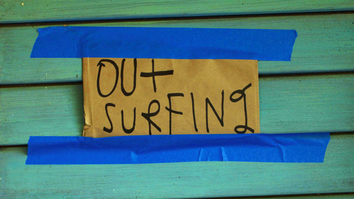 "Out Surfing", that note at his door says it all.