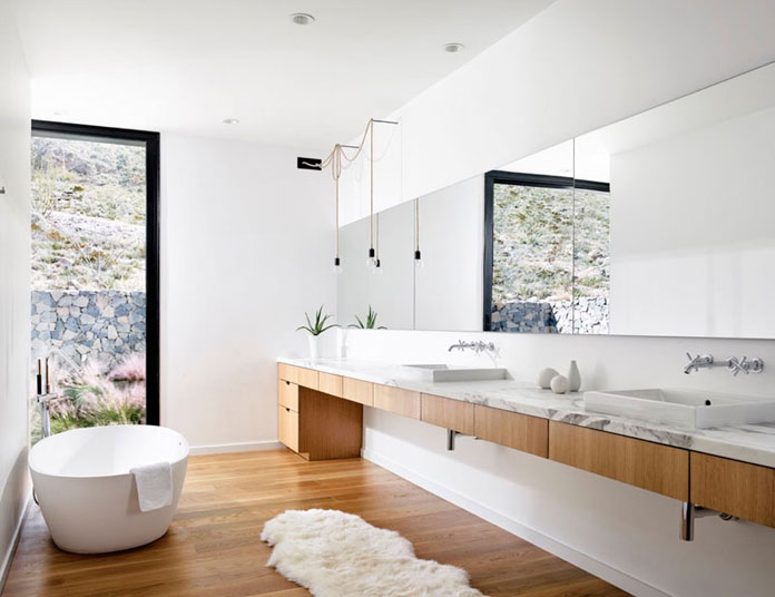 Modern white bathroom design with wood segments. Modern white bathroom design with wood segments.