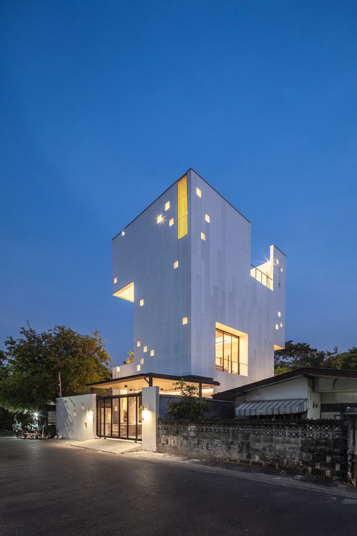 Concrete facade with square-shaped openings.