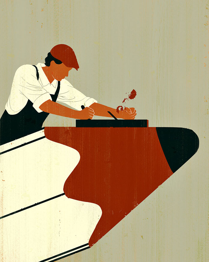 Joey Guidone, a carpenter planes the pencil.