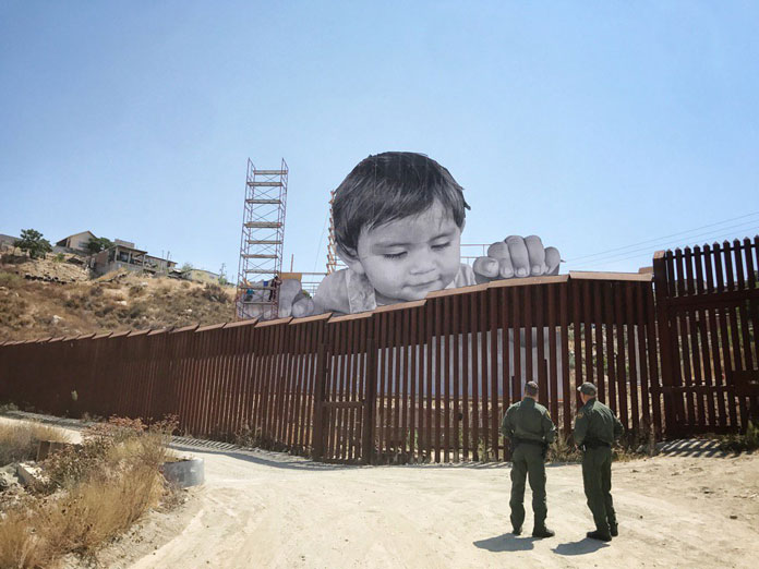 Installation by French artist JR placed on the border between the USA and Mexico.