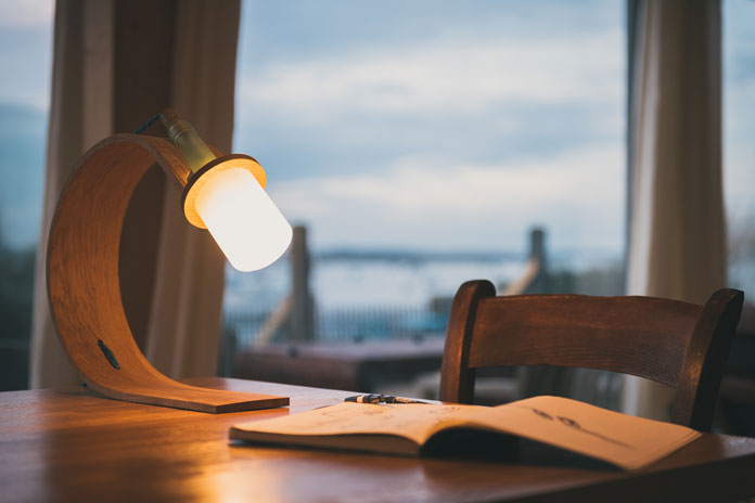 An old win bottle transformed into a stylish desk lamp.