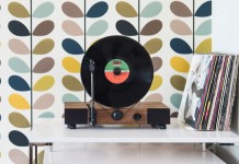 This high-performance vertical turntable with full-range stereo speakers is also a stylish design element for your home.