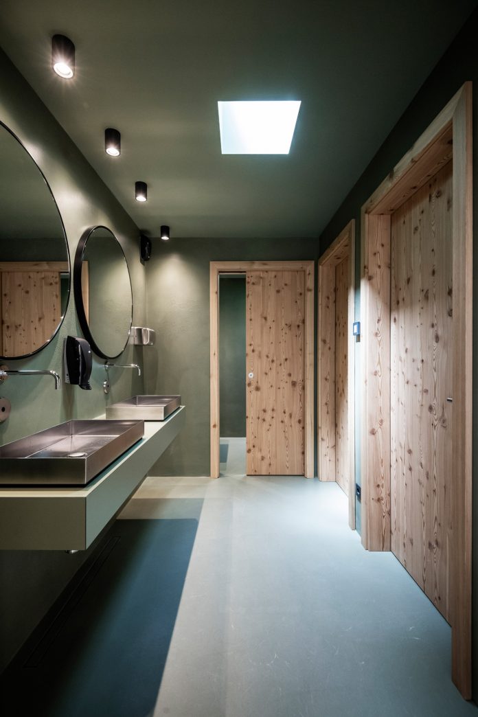 Lake House Völs, a discreet and small lake-hut in the heart of the magnificent mountain landscape of the Sciliar in the South Tyrolean Dolomites in Italy.