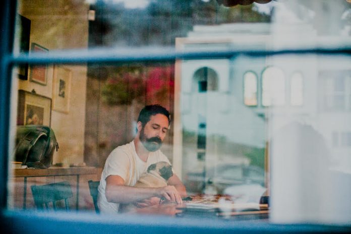 Colter Freeman, filmmaker and writer, and his pug Winona, Elysian Park, Los Angeles