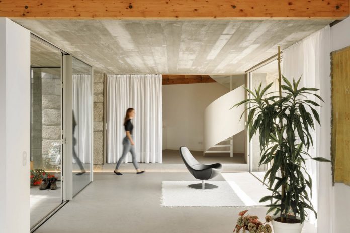 Three old houses converted into one by Paulo Merlini Architects.