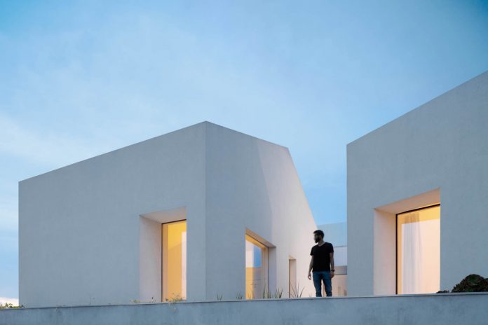 Three old houses converted into one by Paulo Merlini Architects.