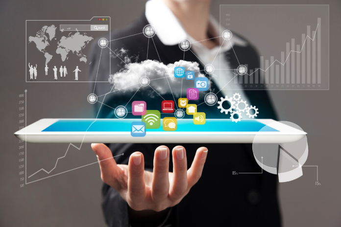 Tablet floating over a hand with visuals of infographics