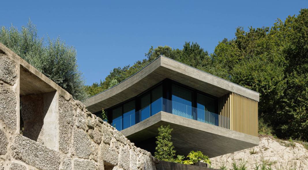 A golden curved house by architecture and design studio Mutant. A golden curved house by architecture and design studio Mutant.