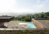 Tsou Arquitectos designed a cork-skinned house that camouflages itself in the landscape.